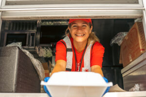 Smiling Volunteer serving on Canteen